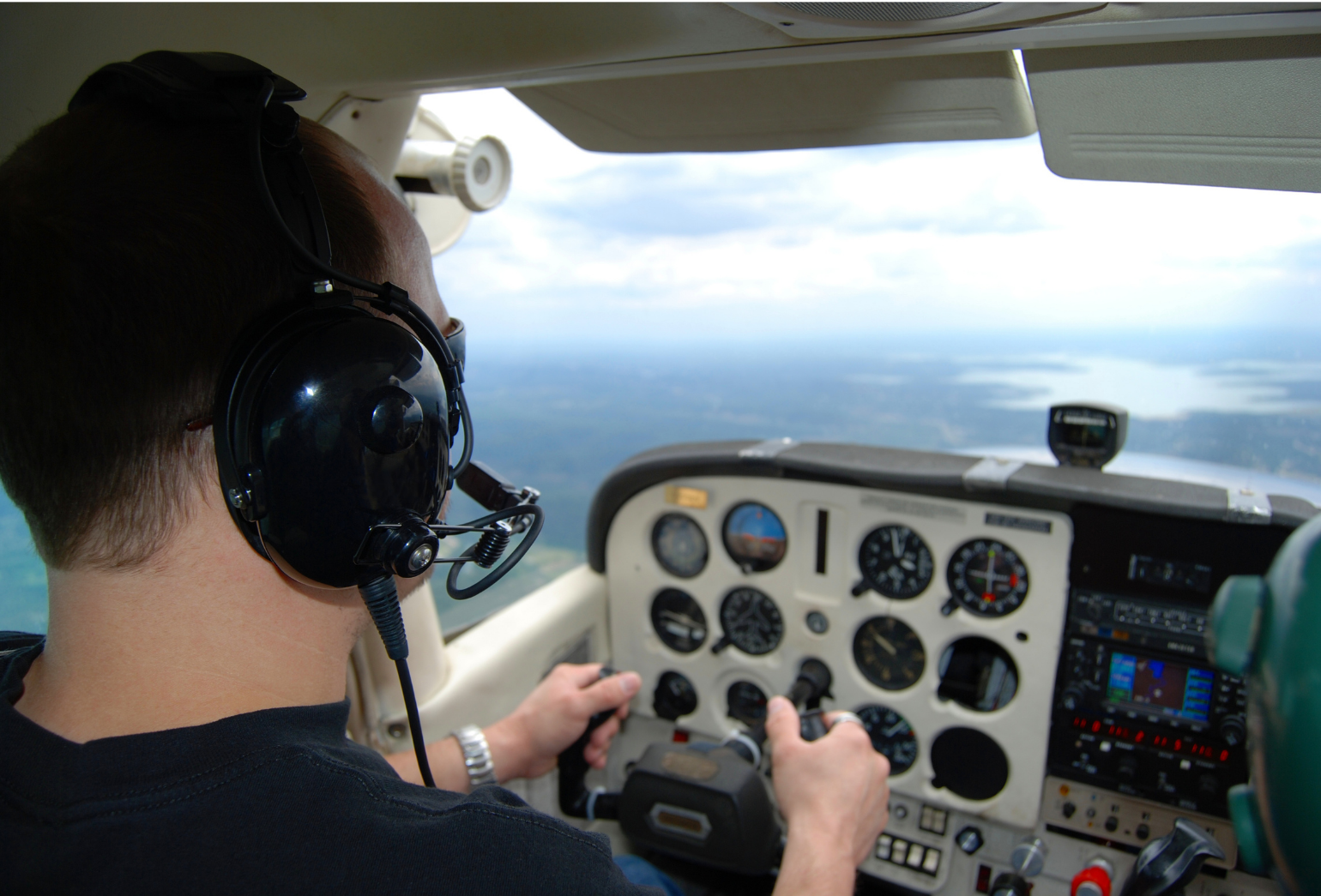 Civil Aviation student pilot - man flying a private plane