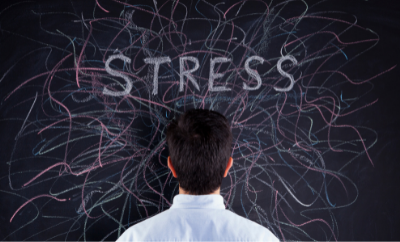 Underwriting Stress - picture of man staring at blackboard showing the word stress