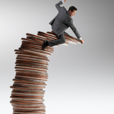 Types of Bankruptcy - picture of man sitting on pile of coins