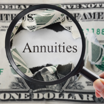 How do annuities work - picture of magnifying glass over ripped dollar bill and the word "annuities"