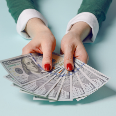 Annuity Case Study - picture of woman's hands holding one hundred dollar billls