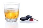 A glass of alcohol with car keys