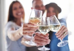 Group of people toasting with their wine glasses