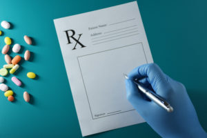 hand writing a prescription