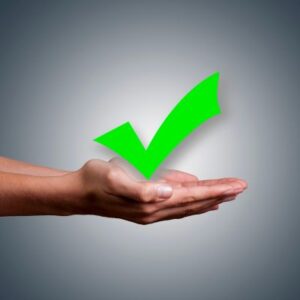 green checkmark held by two cupped hands symbolizing the case mentioned being successfully paid for