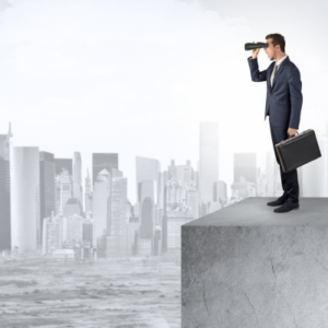 a man looking out over a ledge with binoculars, symbolizing an investor