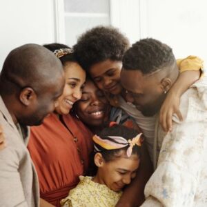 a picture of a large family in a group hug, symbolizing protecting a family