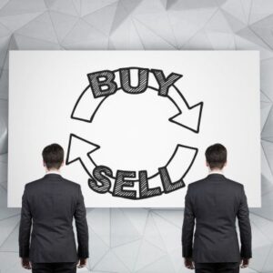 a picture of two men in suits' backs facing the viewer while they look at a screen that says "buy sell" with two circling arrows