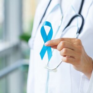 photo of a doctor's torso and hand holding up a blue ribbon, symbolizing prostate cancer awareness for our Prostate Cancer ONE Idea