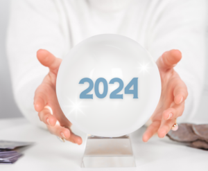 A picture of two hands near a crystal ball with "2024" on it, symbolizing Gonzalo's 2023 Review and 2024 Predictions ONE Idea