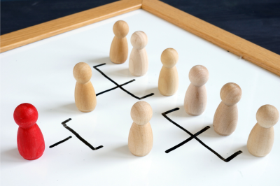 Photo of wooden "people" symbolizing a business's structure